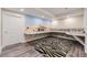Versatile bonus room with unique design, shelving, and space for hobbies at 8778 S Quatar St, Aurora, CO 80016