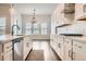 Modern kitchen with a dishwasher, stainless steel appliances, and lots of cabinets at 8778 S Quatar St, Aurora, CO 80016