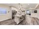 Stylish kitchen island featuring granite countertops, stainless steel appliances, and bar stool seating at 8778 S Quatar St, Aurora, CO 80016