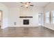Bright living room featuring fireplace and lots of light from the window at 8778 S Quatar St, Aurora, CO 80016