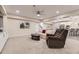 Spacious living room featuring comfortable seating, an entertainment area, and great natural light at 8778 S Quatar St, Aurora, CO 80016