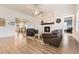 Spacious living room with hardwood floors, a fireplace, and an open layout for modern living at 8778 S Quatar St, Aurora, CO 80016
