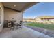 Relaxing covered patio with comfortable seating, offering a serene outdoor living space at 8778 S Quatar St, Aurora, CO 80016