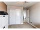 Bright bedroom featuring closet with sliding doors and access to the upper level at 6488 S Kewaunee Way, Aurora, CO 80016