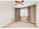 Neutral bedroom features a window with blinds and curtains, with neutral color carpets at 6488 S Kewaunee Way, Aurora, CO 80016
