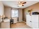 Charming bedroom features a ceiling fan, a window with blinds, and a cozy interior at 6488 S Kewaunee Way, Aurora, CO 80016
