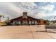 Stunning clubhouse with stone accents, large windows, and outdoor patio area at 6488 S Kewaunee Way, Aurora, CO 80016