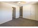 Bright bedroom features a ceiling fan, closet, and attached bathroom at 8746 Mariposa St, Thornton, CO 80260