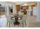 Cozy dining area with a round table adjacent to a well-equipped kitchen at 8746 Mariposa St, Thornton, CO 80260