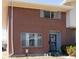 Charming brick townhome featuring a well maintained lawn and front door at 8746 Mariposa St, Thornton, CO 80260