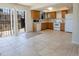 Spacious kitchen with ample cabinets, tile flooring, and white appliances at 8746 Mariposa St, Thornton, CO 80260