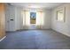 Light-filled living room with neutral wall paint, large windows, and space for furniture at 8746 Mariposa St, Thornton, CO 80260