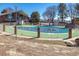 Community pool with chain-link fence and brick pillars in front of a brick building with large windows at 8746 Mariposa St, Thornton, CO 80260