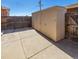 Backyard storage shed with concrete patio and wood fence at 8746 Mariposa St, Thornton, CO 80260