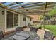Covered patio with dining set and lounge area offers comfortable outdoor living at 7466 E Long Cir, Centennial, CO 80112