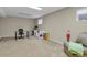 Finished basement area with desk, shelves, and striped couch at 7466 E Long Cir, Centennial, CO 80112