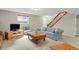 Basement living area with stairs, and a sofa with soft lighting at 7466 E Long Cir, Centennial, CO 80112