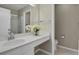 Clean bathroom with a white vanity, a clear shower and lots of natural light at 7466 E Long Cir, Centennial, CO 80112