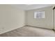 Neutral bedroom with window and wall to wall carpeting at 7466 E Long Cir, Centennial, CO 80112