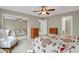 Spacious bedroom with a mirrored closet, neutral carpet, and ample natural light at 7466 E Long Cir, Centennial, CO 80112