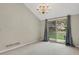 Dining space featuring sliding glass doors to the backyard, neutral walls, and a chandelier at 7466 E Long Cir, Centennial, CO 80112