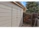 Tan siding with a door and a wooden fence at 7466 E Long Cir, Centennial, CO 80112