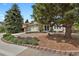 Charming single-Gathering home featuring stone accents, a two-car garage, and a beautifully landscaped front yard at 7466 E Long Cir, Centennial, CO 80112