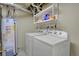 Laundry area with appliances and utility shelving at 7466 E Long Cir, Centennial, CO 80112