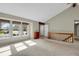 Spacious living area featuring vaulted ceilings, large windows with natural light, and hardwood accents at 7466 E Long Cir, Centennial, CO 80112