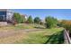 A backyard area and a path separates neighboring homes at 10156 Nottingham Dr, Parker, CO 80134