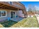 Spacious backyard with patio and stairs leading to a deck at 10156 Nottingham Dr, Parker, CO 80134