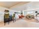 Finished basement with wet bar and multiple seating areas at 10156 Nottingham Dr, Parker, CO 80134
