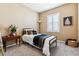 Cozy bedroom with plush carpeting, natural light and a charming decor, creating a relaxing atmosphere at 10156 Nottingham Dr, Parker, CO 80134