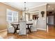 Formal dining room with hardwood floors, and neutral-toned walls, offering a welcoming and elegant space at 10156 Nottingham Dr, Parker, CO 80134