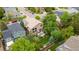 Aerial view of home showcasing a well-maintained lawn, a backyard patio, and mature trees at 10191 Sagecrest St, Highlands Ranch, CO 80126