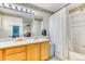 Clean bathroom with vanity, shower, tub combination, and neutral decor at 10191 Sagecrest St, Highlands Ranch, CO 80126