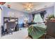 Bedroom with painted blue walls, window, ceiling fan, carpet, and bed at 10191 Sagecrest St, Highlands Ranch, CO 80126