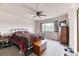 Comfortable bedroom with carpet, ceiling fan, and natural light from a large window at 10191 Sagecrest St, Highlands Ranch, CO 80126