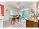 Charming dining area with wooden table, pendant lighting, and sliding glass doors at 10191 Sagecrest St, Highlands Ranch, CO 80126