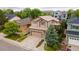 Charming two-story home with a well-maintained lawn, attached two-car garage and inviting curb appeal at 10191 Sagecrest St, Highlands Ranch, CO 80126