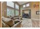 Spacious living room with vaulted ceiling and large windows providing ample natural light at 10191 Sagecrest St, Highlands Ranch, CO 80126