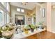 Bright living room featuring hardwood floors, large windows, and neutral wall color at 10191 Sagecrest St, Highlands Ranch, CO 80126