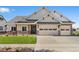 Charming single-Gathering home with two-car garage, stone accents, and a well-manicured front lawn at 1402 Burt Ave, Berthoud, CO 80513