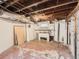 Spacious unfinished basement with exposed beams and a utility area at 3833 Umatilla St, Denver, CO 80211