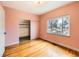 Bright bedroom features hardwood floors and closet at 3833 Umatilla St, Denver, CO 80211