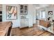 Charming dining room featuring hardwood floors, stylish built-ins, and an inviting open layout at 3833 Umatilla St, Denver, CO 80211