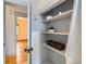 Hallway closet with built in shelving at 3833 Umatilla St, Denver, CO 80211