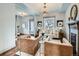 Bright living room with hardwood floors, stylish furnishings, and a chandelier at 3833 Umatilla St, Denver, CO 80211