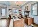 Bright and airy living room featuring hardwood floors, a fireplace, and ample seating at 3833 Umatilla St, Denver, CO 80211