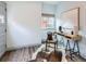 Comfortable home office with modern desk, area rug, natural light, and inviting decor at 3833 Umatilla St, Denver, CO 80211